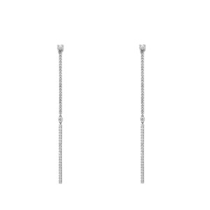 An image of a pair of Messika women's Barrettes Gatsby 18k white gold earrings with diamonds, presented in a front-facing view against a white background. The earrings are aligned vertically and symmetrically, showcasing a linear drop design with a larger diamond at the top and smaller diamonds encrusted along the entire length. The image is taken from a medium distance, allowing clear visibility of the earrings' details and sparkle.