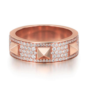 An image of a Messika women's Spiky band ring with diamonds, presented in a close-up view against a white background. The ring is centered and shown from a slightly elevated angle to highlight the intricate design and sparkle of the diamonds. The 18k rose gold band is encrusted with multiple round-cut diamonds, complemented by geometric rose gold accents that create a luxurious and elegant appearance. The composition is such that the details of the ring's design and the brilliance of the diamonds are clearly visible, with the ring occupying a prominent position in the frame.