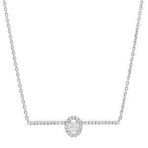 An image of a Messika brand women's Glam'Azone chain 18k white gold necklace with diamonds displayed against a white background. It presents a front-facing view with a central, larger diamond encircled by a halo of smaller diamonds, which are also set along the horizontal bar of the necklace. The chain features linked, round, diamond-cut elements and extends symmetrically from either side of the central piece. The necklace is photographed from a straight-on angle at a close distance, emphasizing the sparkle and design detail.