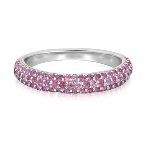 An image of a Rachel Koen women's ring with pink sapphire gemstones, displayed in a close-up side view on a white background. The ring is centered in the frame, showcasing a band fully encrusted with round-cut pink sapphire gemstones, creating a continuous sparkle around its circumference in white gold. The metallic part of the ring appears to have a silver tone, complementing the gemstones' pink hues. The perspective of the image is head-on at a slight angle, providing a clear view of the gemstones' arrangement and the ring's overall design.