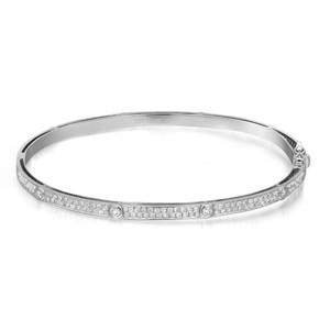 An image of a Rachel Koen women's bangle bracelet with diamonds, showcased in a close frontal view against a white background. The bracelet is presented in a slight left-angled position, allowing the row of neatly set round cut diamonds along the top surface to catch the light and sparkle. The bracelet's band is a slim, polished silver tone, marked with "18K 750 KF" indicating its quality, and the clasp is visible on the right side in white gold. The image is taken from a medium distance, providing a clear view of the bracelet's design and the intricate details of the diamonds.