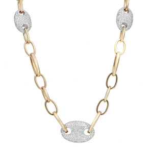 An image of a Rachel Koen women's necklace with diamonds, displayed against a white background. The necklace features a series of elongated gold links connected by three oval links encrusted with round cut diamonds in yellow gold. The necklace is positioned in a slight 'V' shape, with the central diamond pendant directly facing the viewer and the adjacent diamond pendants angled away, creating a sense of depth. The necklace is photographed from a front, centered perspective, showcasing its design and the sparkle of the diamonds.