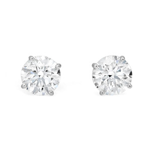 An image of a pair of Rachel Koen unisex adult lab grown diamond stud earrings, displayed frontally at a close range. Each earring features a large, round-cut diamond securely held in place by four prongs in white gold, with a white background that accentuates their brilliance.