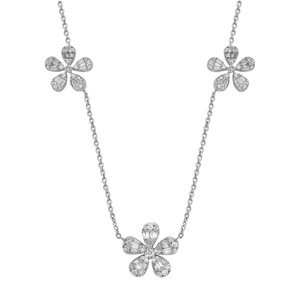 An image of a Rachel Koen women's necklace with diamonds, displayed against a white background. The necklace features a symmetrical design with three diamond-encrusted flower pendants equidistant from each other along a white gold chain. The central flower is positioned at the bottom center, with the other two flowers angled slightly upward on either side, creating a gentle V shape. The flowers are made up of teardrop-shapes with studded round and baguette cut diamonds arranged to form petals around a central round diamond. The chain has a fine, twisted rope-like texture and is shown from a front-facing view, with the entire necklace appearing in sharp focus, suggesting a close-up photograph.