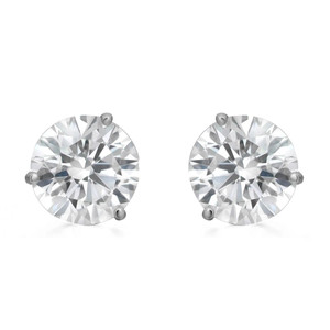 An image of a pair of Rachel Koen brand unisex adult earrings with lab grown diamonds, displayed frontally. The earrings feature large, round-cut diamonds held in place by four-prong setting in white gold, with the light reflecting off the facets to showcase their brilliance. The view is a close-up, emphasizing the sparkle and design of the diamonds at a direct angle, against a white background for contrast.