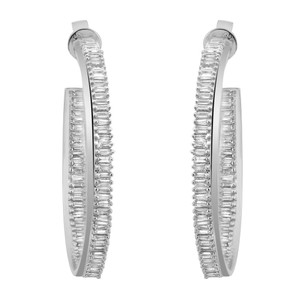 An image of a pair of Rachel Koen women's earrings with diamonds, displayed frontally and centered. The earrings are hoop-shaped with a line of clear, rectangular baguette cut diamonds set along the outer edge and a matching line along the inner edge, giving a continuous sparkling appearance. The metal setting is polished white gold, and the earrings are at an equal distance from the viewer, with a direct and unobstructed view.