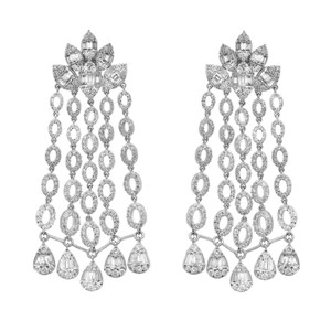 An image of a pair of Rachel Koen women's earrings with diamonds, presented on a white background. The earrings feature a symmetrical design with a top section resembling a flower made of baguette and round-cut diamonds, from which multiple strands of diamond-encrusted oval links cascade down. Each strand terminates with a larger, teardrop-shaped diamond. The earrings are positioned vertically, facing forward, with a slight space between them that emphasizes their identical design and length. The perspective is head-on, allowing for a clear view of the intricate details and the sparkle of the diamonds. The distance from the viewer is such that the earrings appear prominently, occupying a significant portion of the frame for a detailed examination.