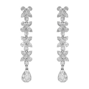 An image of a pair of Rachel Koen women's earrings with diamonds, showcased frontally at a close distance. The earrings feature a vertical alignment of ornate floral motifs, each composed of multiple baguette and round cut diamond-encrusted petals, leading down to a teardrop-shaped diamond drop hanging. The background is white, highlighting the intricate design and sparkling facets of the diamonds.