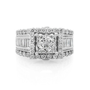 An image of a Rachel Koen women's engagement white gold ring with diamonds. The ring is presented in a frontal view with a slight angle to show depth, positioned centrally. It features a prominent princess-cut diamond in the center, surrounded by round-cut diamonds, with baguette-cut diamonds on both sides. The setting is designed to maximize sparkle, with diamonds encrusting the entire visible surface. The photo is taken from a close distance, providing a clear view of the ring's intricate details and the stones' brilliance.