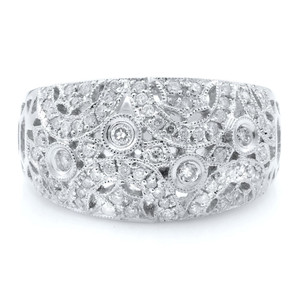 An image of a Rachel Koen women's dome ring with diamonds seton a white gold band, showcasing a front-facing view against a white background. The intricate design features multiple diamonds of varying sizes and shapes, set in a detailed filigree pattern that covers the entire visible surface of the ring. The ring is photographed at a close distance, with a slight angle to emphasize the sparkle and texture of the diamonds.