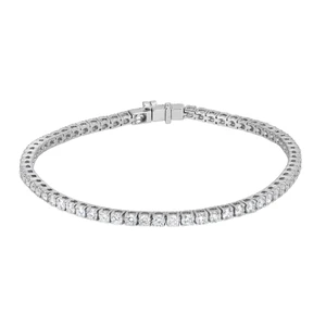 An image of a Rachel Koen lab grown diamond bracelet designed for unisex adults, displayed against a white background. The bracelet is shown in a straight, horizontal position with the clasp visible at the top center. It features a single row of uniformly sized, round-cut diamonds set in a white gold metal, providing a continuous sparkle throughout. The image is taken from a front-on angle at a close distance, offering a clear view of the diamonds and the intricate setting details.