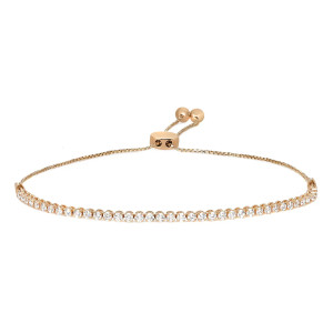 An image of a Rachel Koen women's bracelet with lab grown diamonds, displayed in a straight line at a slight angle from the top view perspective. The bracelet features a delicate yellow gold chain with evenly spaced, round-cut diamonds set halfway through its length, glistening against a white background. The clasp mechanism, visible on the right, includes a gold bead drawstring design for size adjustment, showcasing the bracelet's elegant and refined aesthetic from a medium distance.