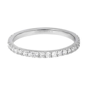 An image of a Rachel Koen brand lab grown diamond ring for women, displayed in a close-up front view. The ring features a circle of round-cut diamonds set halfway in a polished white gold band, with the band's profile and the individual diamonds clearly visible. The engraving indicating the metal purity and diamond weight is slightly visible on the inner side of the band. The ring is centered and occupies the middle portion of the image against a white background.
