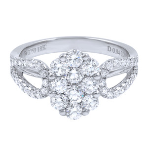 An image of a women's Rachel Koen brand ring with diamonds, positioned front and center. The ring features a cluster of large diamonds at the top, forming a floral pattern, with smaller diamonds encrusting the split shank band. The view is a close-up, head-on shot, showcasing the intricate design and sparkle of the stones. The band is inscribed with "G750 18K" and "D 0.94 ct." indicating the gold purity and total diamond weight. The ring is displayed against a white background, highlighting its brilliance and craftsmanship.