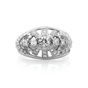An image of a Rachel Koen women's cocktail ring with diamonds displayed at a front-facing angle on a white background. The ring features a symmetrical arrangement of multiple round cut diamonds set in a polished white gold band, with the largest diamond centered. The photo is taken from a close, yet comfortable distance that clearly shows the intricate setting and sparkling facets of the diamonds. The ring is pre-owned in great condition. 