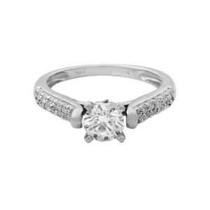 An image of a Rachel Koen women's engagement ring with diamonds, displayed in a front-facing view against a white background. The ring features a prominent central round-cut diamond, set in a raised prong setting, flanked by smaller pavé-set diamonds along the top half of the band. The band itself is polished, made of white gold, with a visible hallmark indicating "14K." The image is taken from a close-up angle to highlight the details of the gemstones and the setting, providing an unobstructed view of the ring's design.