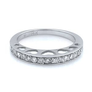 An image of a Rachel Koen brand women's wedding ring with diamonds, captured from a side angle showing both the inner and outer edges. The ring is positioned centrally and photographed up close to display details. It features a band of encrusted diamonds around the circumference, set in a white gold band with 14K hallmark visible, and has open heart-shaped cutouts along the sides.