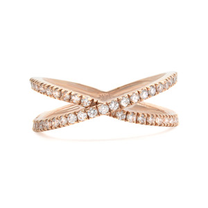 An image of a Rachel Koen brand women's ring with diamonds. The ring features a unique crisscross design and is set in rose gold. It is positioned centrally against a white background, with the top part angled slightly towards the viewer and the bottom part angled away, creating a sense of depth. The diamonds are encrusted along the entirety of the crossed bands, and the ring is photographed from a close distance, focusing on the sparkle and intricate details of the setting.
