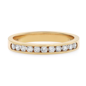 An image of a Rachel Koen women's wedding ring with diamonds, showcased at a slight angle to display the row of sparkling diamonds set in the top half of the band. The yellow gold band is in sharp focus and shown from a close, direct front view, allowing clear visibility of the gemstones and the sleek design of the ring.The ring is pre-owned in a great condition. 