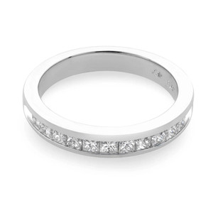 An image of a Rachel Koen women's wedding band ring with diamonds, viewed from a high angle slightly above the ring, showcasing the top and side of the band. The ring is centered and positioned horizontally across the frame, with a close-up view that highlights the row of sparkling princess-cut diamonds set halfway around the polished platinum band. The background is a neutral white, emphasizing the ring's design and brilliance. The ring is pre owned in a great condition. 
