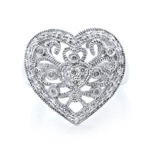 An image of a heart-shaped Rachel Koen women's ring with diamonds, displayed in a close-up, straight-on view that highlights the intricate design and sparkling stones. The ring appears to be placed against a white background, emphasizing its detailed craftsmanship and the brilliance of the diamonds.