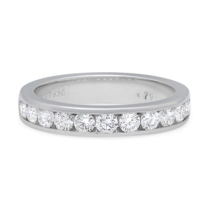 An image of a Rachel Koen women's wedding eternity ring with diamonds, positioned centrally and viewed from a side angle that showcases the full circle of the band. The ring features a continuous row of round-cut diamonds set in a channel along the top half, with a polished platinum band visible. The image is taken from a close distance, providing a clear view of the diamonds' facets and the ring's design.The ring is pre-owned in great condition. 