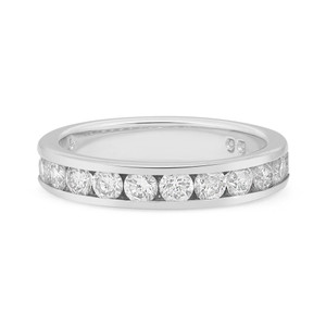 An image of a Rachel Koen brand unisex adult wedding ring with diamonds displayed in a close-up, front-facing view. The ring features a band of round-cut diamonds set in a channel that encircles the ring. The diamonds are evenly spaced and catch the light, showcasing their brilliance. The metal setting of the ring is white gold polished, enhancing the reflection and sparkle of the gemstones. The ring is centered horizontally within the frame, with a neutral background that contrasts with the metallic sheen of the ring. The image is taken from a slightly elevated angle, emphasizing the ring's profile and the alignment of the diamonds. The ring is pre owned in a great condition.
