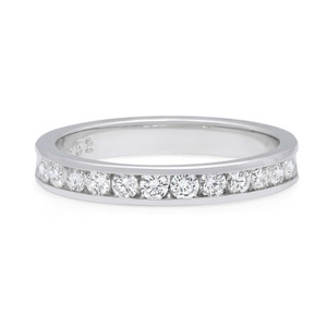 An image of a Rachel Koen brand women's wedding ring with diamonds, displayed frontally at a close distance. The ring is positioned horizontally in the center of the frame, showcasing a band of round-cut diamonds set in a channel along the top half of the ring. The metal appears white gold polished and the diamonds are positioned in such a way that their facets are visible, reflecting light from various angles.The ring is pre owned in a great condition.