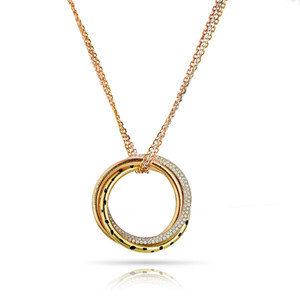 An image of a Cartier women's Tri Color Trinity Panthere Pendant necklace with diamonds, centered and shown up close. The necklace features a multi-layered circular pendant with yellow gold outer ring and a smaller concentric ring adorned with diamonds. The inner ring is yellow gold with black enamel, and the pendant is suspended from a yellow gold chain. The image is taken from a front-facing angle, showcasing the sparkle of the diamonds and the intricate design of the pendant against a white background with a subtle reflection beneath. Comes in a great preowned condition.