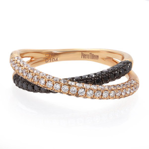 An image of a Piero Milano women's ring with white and black diamonds, showcasing a close-up view on a white background. The ring features a rose gold band with two intertwined bands, one adorned with pave set white diamonds and the other with black diamonds. The details of the diamonds are visible, sparkling against the polished rose gold. The brand name "Piero Milano" is engraved on the inner side of the band, indicating its authenticity. The earring is positioned at a slight angle to show the interplay of light and the intricate design.