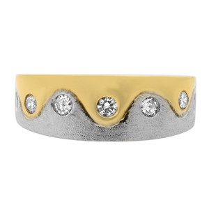 An image of a Rachel Koen women's ring with diamonds, centered and photographed from a front-facing angle against a white background. The ring features a two-tone design with a yellow gold upper half and a textured white gold lower half. It has a wavy contour with multiple round, brilliant-cut diamonds evenly spaced and bezel-set along the wave peaks. The image is taken from a close distance, highlighting the ring's details and the sparkle of the diamonds.The ring is preowned in a great condition. 