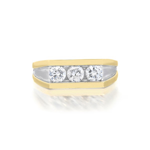 An image of a men's Rachel Koen ring with diamonds, showing a front-facing view against a white background. The ring features a yellow gold band with a smooth, rectangular surface holding a row of three prominent, round-cut diamonds set closely together. The diamonds are displayed at a slight angle, providing a clear view of their facets and brilliance. The image is taken from a close distance to highlight the details of the diamond settings and the reflective quality of the polished gold.The ring is pre-owned in a great condition. 