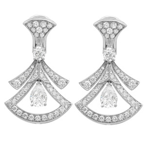An image of a pair of Bvlgari Divas' Dream women's pear and round cut diamond earrings. The earrings are displayed against a white background, positioned symmetrically side by side and facing forward. Each earring features a geometrical design with three teardrop-shaped outlines adorned with pavé diamonds and a single larger teardrop diamond hanging in the centermost space. The earrings have a polished white gold finish, and the diamonds catch the light, emphasizing their sparkle. The view is head-on, offering a clear and detailed view of the intricate design and craftsmanship from a medium distance.