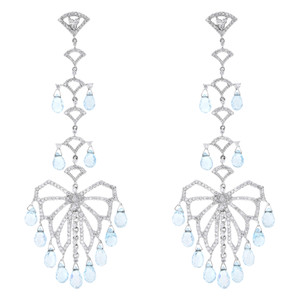 An image of a pair of Rachel Koen women's chandelier drop dangle earrings featuring diamonds and aquamarine set in a white gold. The earrings are displayed against a white background in a symmetrical frontal view. Both earrings are positioned vertically with a slight distance between them, offering a clear view of their intricate design. They consist of a series of interconnected diamond-studded shapes, culminating in a large, ornate drop-shaped element at the bottom, from which multiple teardrop-shaped blue aquamarine dangle gracefully. The overall impression is one of elegance and luxury.