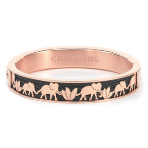 An image of a Charriol women's bracelet without stones, displayed in a close-up, angled view to highlight its design details. The bracelet has a smooth, polished rose gold finish in stainless steel with the brand name "CHARRIOL" engraved on the top surface. It features a cut-out pattern of elephants and flora against a dark background, creating a striking contrast. The bracelet is positioned horizontally in the center of the frame, with the focus on the intricate cut-out design. Bracelet size is large.