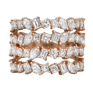 An image of a women's Rachel Koen ring with diamonds. The ring features three stacked bands adorned with multi shaped diamonds, including round, marquise, princess and emerald cuts. The image is taken from a front angle, showcasing the intricate detailing and sparkle of the diamonds. The close-up view highlights the yellow gold setting, emphasizing the elegant and luxurious design.