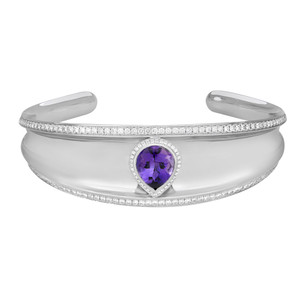 An image of a women's cuff bracelet by Chopard, featuring a polished white gold band adorned with a central pear-shaped imperial amethyst. The gemstone is surrounded by a halo of diamonds. The bracelet is positioned horizontally, viewed from a slight angle above, displaying the front and top surfaces. The photo is taken at a close distance to highlight the intricate details.