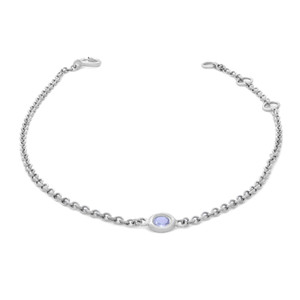 An image of a women's bracelet by Rachel Koen, featuring a delicate chain with a single bezel set round cut aquamarine gemstone set in the center. The bracelet is positioned against a white background, captured at a slightly elevated angle that showcases its circular shape and elegant design. The gemstone is prominently displayed, allowing for a clear view of its color and setting, while the chain is visible from a moderate distance, highlighting its intricate links and clasp.