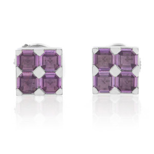 An image of a pair of Chopard 18k white gold stud earrings for women, featuring square-shaped settings adorned with purple amethyst gemstones. The earrings are positioned side by side, facing forward, and are photographed from a straight-on angle at a close distance, highlighting the geometric design and vivid color of the gemstones.