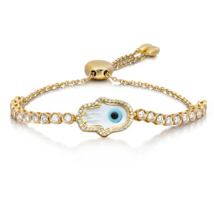 An image of a unisex adult bracelet by Rachel Koen, featuring diamonds. The bracelet is positioned at a slight angle, showcasing its intricate design. At the center is a decorative element resembling an eye, surrounded by a series of circular diamonds set in yellow gold. The image captures the bracelet from a close distance, highlighting the texture and sparkle of the materials.