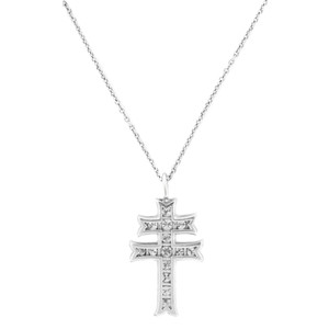 An image of a women's platinum necklace by Rachel Koen, featuring a diamond-studded cross pendant. The necklace is displayed against a plain white background. The chain is shown in a straight line, with the cross pendant centered and hanging vertically. The image is taken from a front-facing angle at a medium distance, clearly capturing the intricate details of the diamonds and the design of the pendant.Excellent pre-owned condition. 