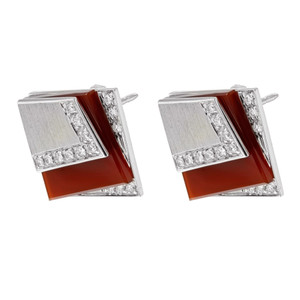 An image of Salavetti women's earrings featuring a geometric design with diamonds. The earrings are positioned side by side, slightly angled to the left, showcasing their intricate details. The close-up view highlights the contrast between the shimmering diamonds and the glossy gemstones.