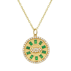 An image of a women's necklace by Rachel Koen, featuring a round pendant with a design of alternating baguette cut green emerald gemstones and round diamonds. The pendant is centrally positioned, hanging from a fine yellow gold chain. The pendant displays a radial arrangement of rectangular green emeralds, surrounded by a circle of diamonds. The photo is taken from a front angle, providing a clear, close-up view of the intricate details.