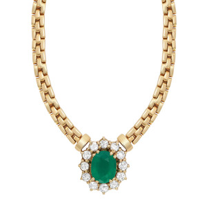 An image of a women's necklace by Rachel Koen, featuring a central oval green emerald gemstone encircled by sparkling round cut diamonds. The necklace is made of yellow gold links, elegantly positioned in the center of the image, captured from a straight-on angle at a close distance, highlighting its intricate design and luxurious materials. Excellent preowned condition.