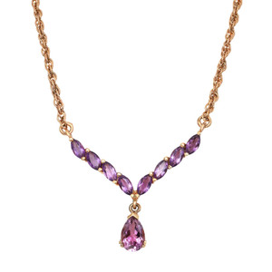 An image of a women's necklace by Rachel Koen, featuring a row of prong set marquise-cut purple amethyst gemstones set along a gold color sterling silver chain. At the center, a larger pear-shaped purple amethyst gemstone hangs as a pendant. The necklace is displayed flat against a white background, captured from a front-facing angle at a close distance to highlight the intricate details and vibrant colors of the gemstones. Greta preowned condition. 