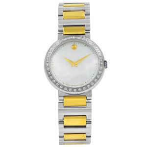 An image of a Wristwatch by Movado. This Pre Owned item is designed for Women, featuring a Casual style. It has a Quartz movement and an Analog display with a White dial color. The indices include 12-Hour Dial,No Hour Marks,Round Indexes. The band is made of Stainless Steel and the case is made of Stainless Steel. The watch has a Round shape with a case size of 30 mm and a case thickness of 7 mm.