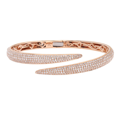 An image of a Rachel Koen women's bracelet with diamonds, displayed on a white background. The bracelet is rose gold and features an open double-band design. The top band is angled slightly away from the viewer, showcasing rows of small, glittering round cut diamonds. The bottom band is partially visible with intricate cut-out patterns. The clasp is visible at the top center. The image is taken from a close, overhead perspective, allowing for detailed viewing of the diamonds and craftsmanship.
