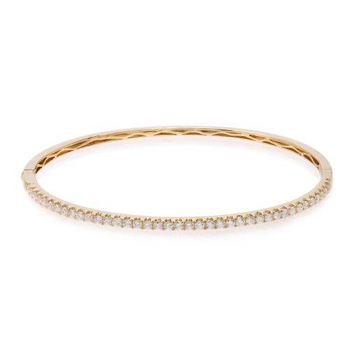 An image of a Rachel Koen women's bracelet with round cut diamonds. The bracelet is positioned horizontally in the center of the frame with a front-facing view, highlighting a row of sparkling diamonds set along the top edge. The bracelet is crafted in yellow gold and is photographed from a close distance against a white background, allowing clear visibility of the diamonds' facets and the bracelet's intricate design.