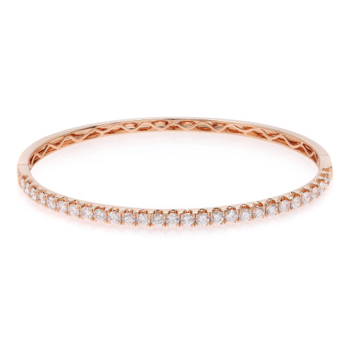 An image of a Rachel Koen women's bracelet with diamonds, displayed in a close-up, centered view against a white background. The bracelet is oriented horizontally across the frame, showcasing its full circle with a rose gold band and a single row of sparkling round cut diamonds along the top visible surface. Carved details are visible on the inner side of the band, demonstrating the intricate design. The perspective is head-on, allowing the diamonds to catch the light and exhibit their brilliance.