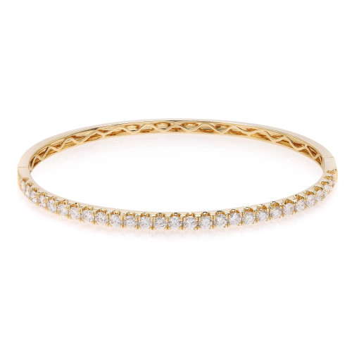 An image of a Rachel Koen women's bracelet with diamonds, displayed in a straight-on frontal view against a white background. The bracelet is positioned horizontally in the center of the frame, with the focus on the outer edge showcasing a continuous row of sparkling round cut diamonds set in a polished yellow gold band. The intricate design details on the inner side of the band are partially visible, adding to the luxurious appearance. The image is taken from a close distance, allowing for clear visibility of the bracelet's features and craftsmanship.